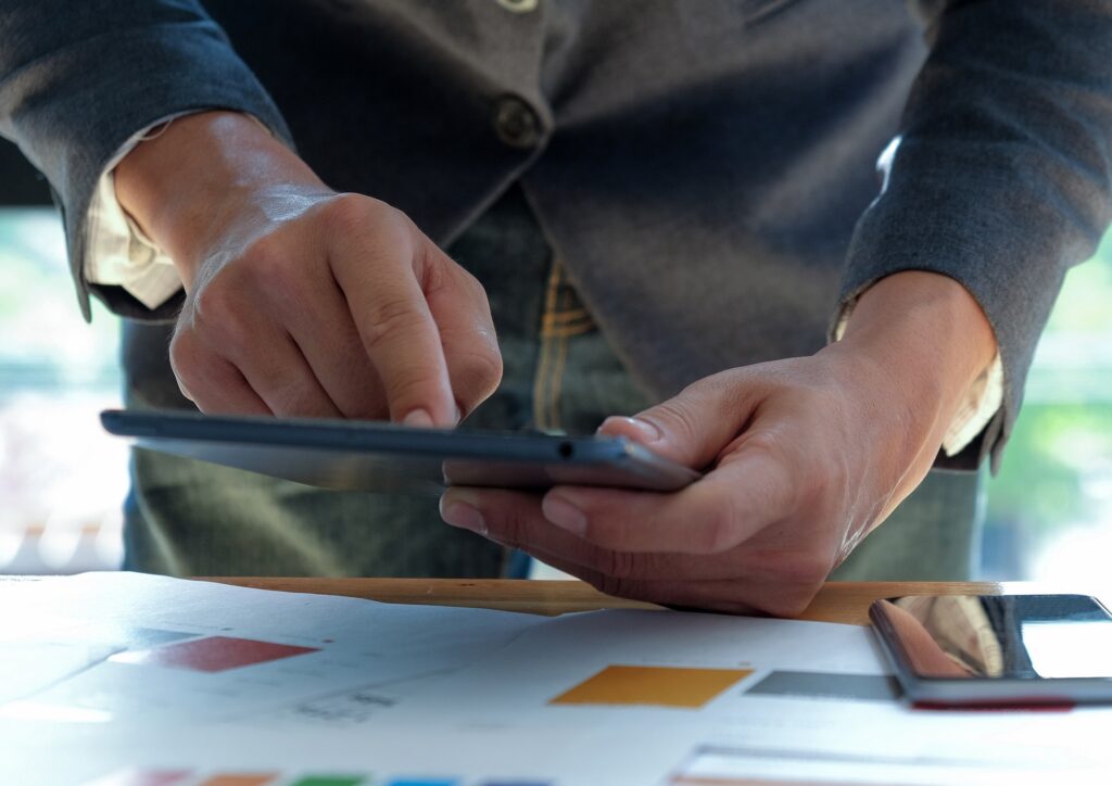 Business people working at office desk and using touch screen ta